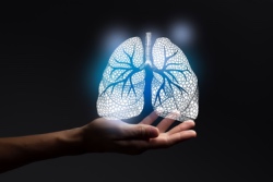 Afbeelding van hand met lichtgevende longen